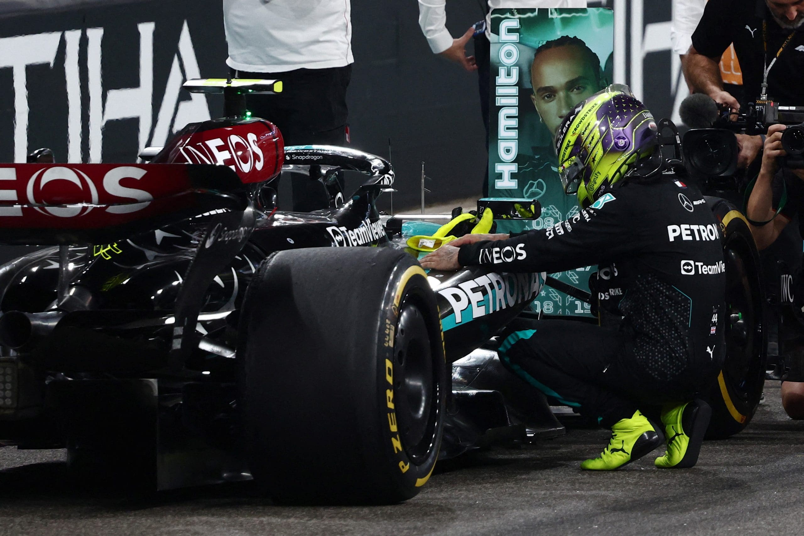 an image of hamilton and his car